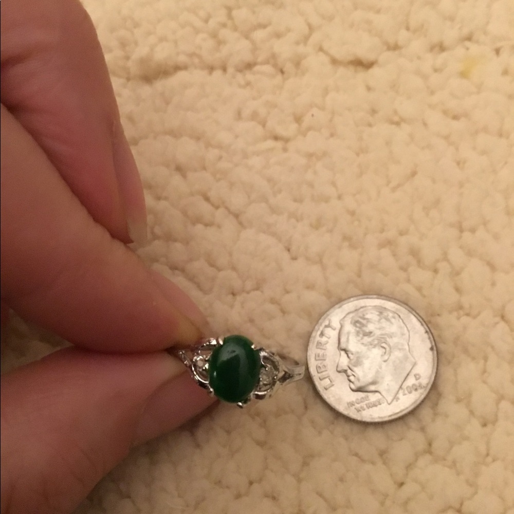 18k white gold plated ring with green stone.